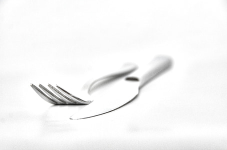 gray bread knife beside fork thumbnail