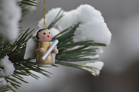 shallow focus photography of angel Christmas tree decor thumbnail