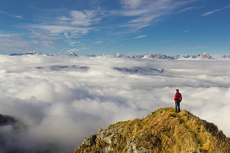Man Standing on Mountain Against Sky thumbnail