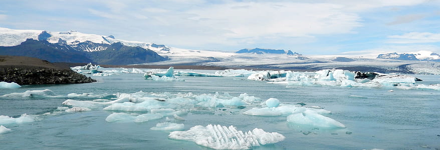 icebergs near mountains during daytime thumbnail