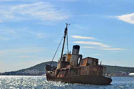 brown cargo ship on sea thumbnail