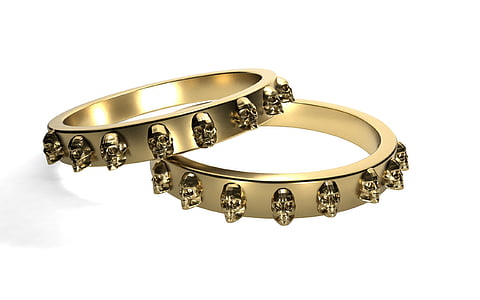 pair of gold-colored ring closeup photography thumbnail