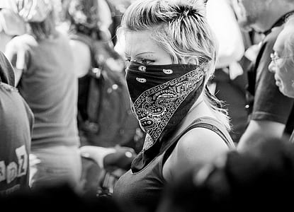 grayscale photography of woman covered with handkerchief on her face thumbnail