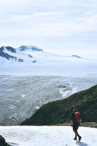 man standing on alp mountain cliff thumbnail