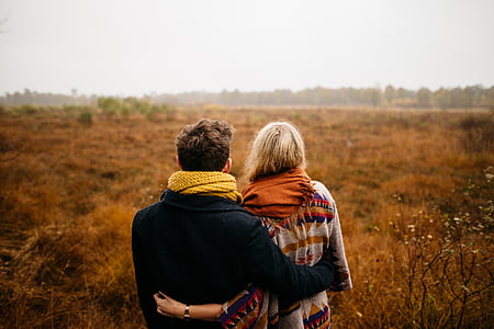 man and woman embracing each other during daytime thumbnail