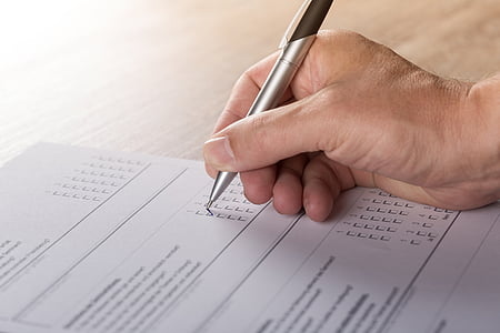 person holding gray pen on right hand thumbnail