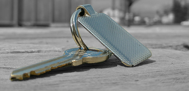 key on wooden surface thumbnail