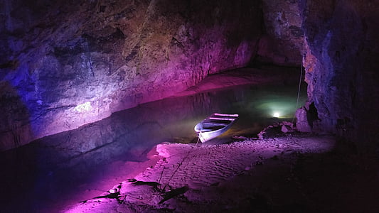 boat near shore inside cave thumbnail