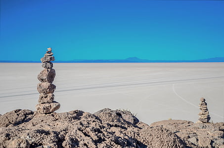 gray rocks near desert at daytime thumbnail
