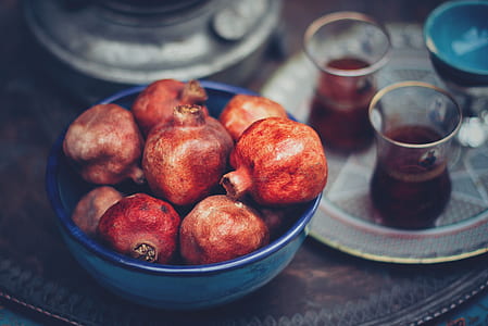 round red fruits on blue ceramic bowl thumbnail