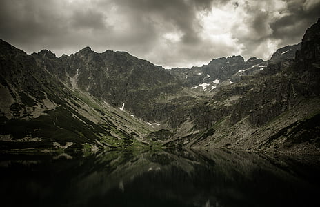 green mountain under gray sky thumbnail