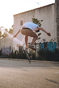 man jumping with skateboard time lapse photography thumbnail