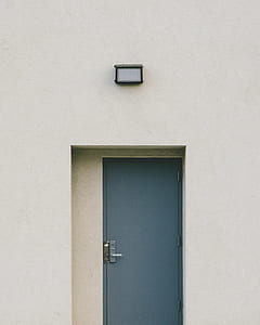 gray metal door and white painted wall thumbnail