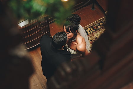 couple kissing near drawer chest thumbnail