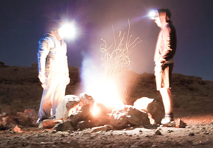 two men standing near bonfire thumbnail