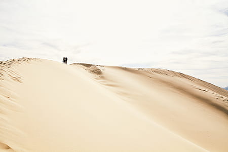 two person standing in dessert mountain thumbnail