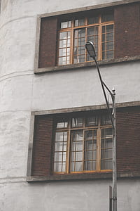 gray and black street lights near concrete building thumbnail