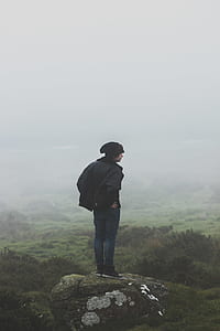 man standing on mountain edge thumbnail