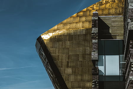 brown building under blue sky thumbnail