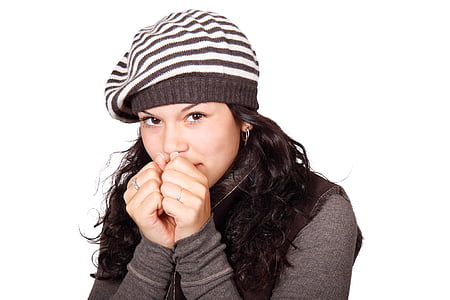 woman with white and black striped knit cap and black long-sleeved top thumbnail