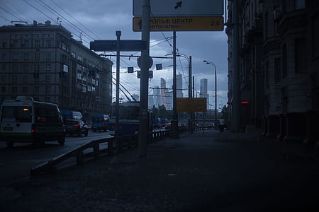 photo of white van near side walk during nighttime thumbnail