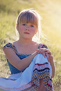 girl sitting down on ground thumbnail
