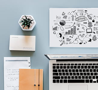 Macbook Air Beside Printing Paper thumbnail