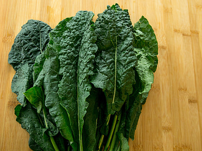 green bok choy on brown wooden surface thumbnail