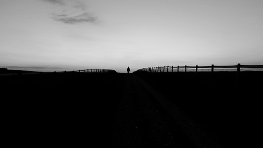person standing on road silhouette photo thumbnail