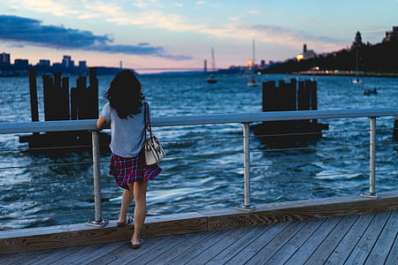 girl sight seeing near bay thumbnail
