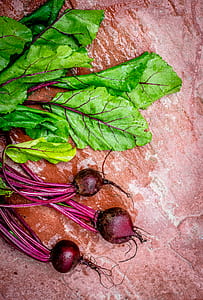 red onions on red table surface thumbnail