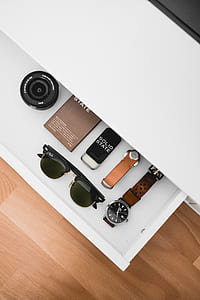 black DSLR camera lens with clubmaster sunglasses on white surface thumbnail