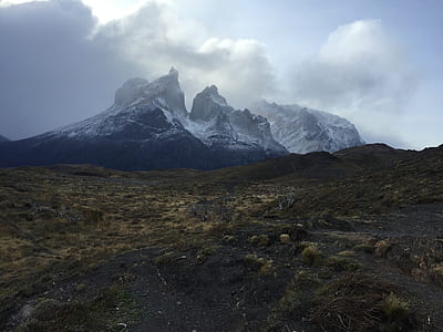 mountain alps near green grass field thumbnail