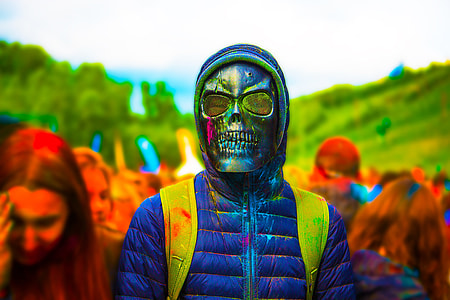 person wearing blue skull mask thumbnail