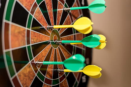 brown and black dart board with dart pins thumbnail