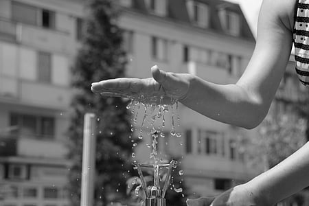 grayscale photography of person tapping water shower thumbnail