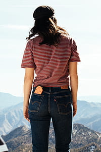 person standing looking at the mountain thumbnail