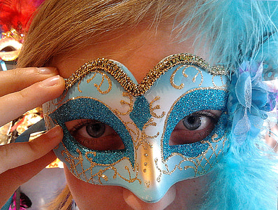 man holding blue and white party mascara thumbnail