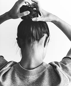 Grayscale Photography of Woman Raising Both Hands thumbnail