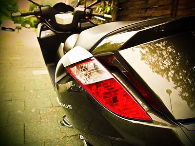 closeup photo of black motor scooter thumbnail
