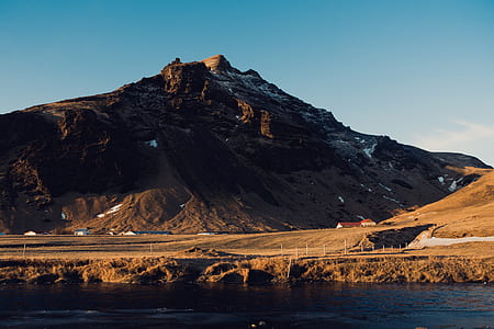 mountain near body of water thumbnail