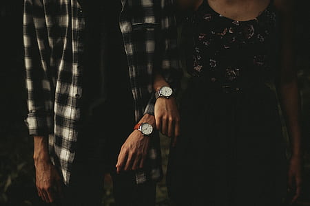 man and woman with matching pairs of watches thumbnail