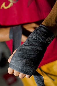 person wearing black fingerless gloves close-up photo thumbnail