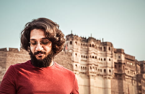 man wearing red shirt at daytime thumbnail