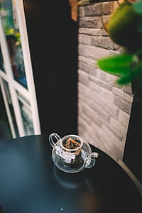 clear glass teapot with plant thumbnail