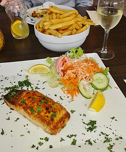 deep fried fries, cooked meat and sliced cucumber with carrots thumbnail