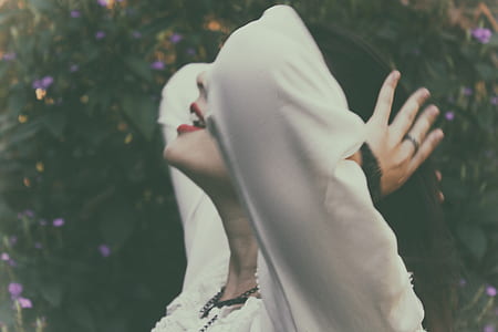 person wearing white long-sleeved top thumbnail