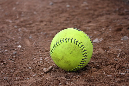 Yellow and Black Tennis Ball in Brown Soil thumbnail