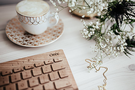 Wooden keyboard and cup of coffee thumbnail