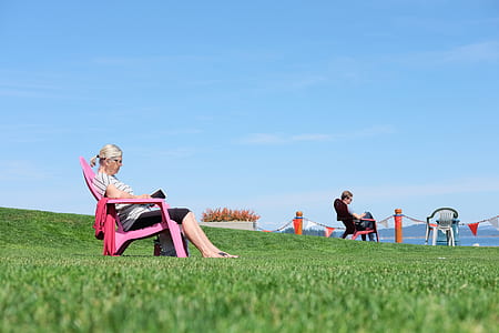 woman seating on armchair white reading thumbnail